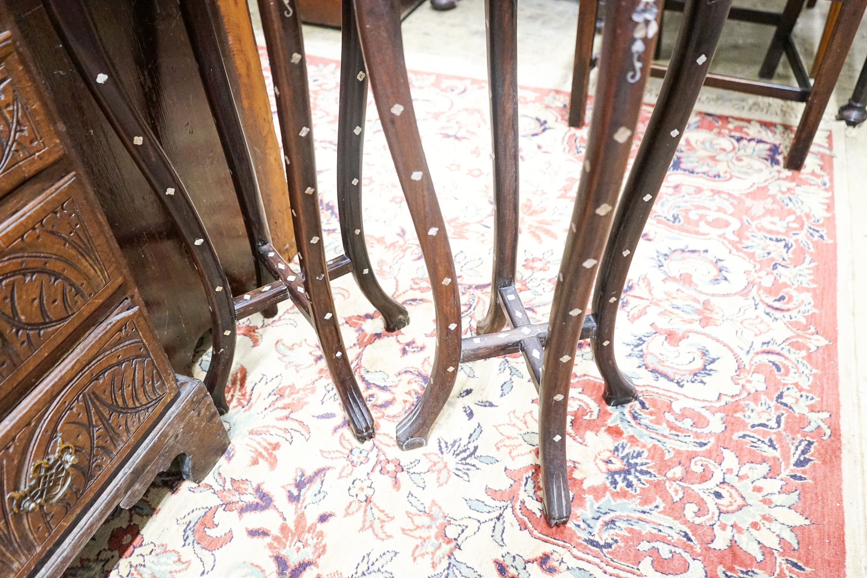 A pair of Chinese mother of pearl inset hardwood vase stands, height 92cm